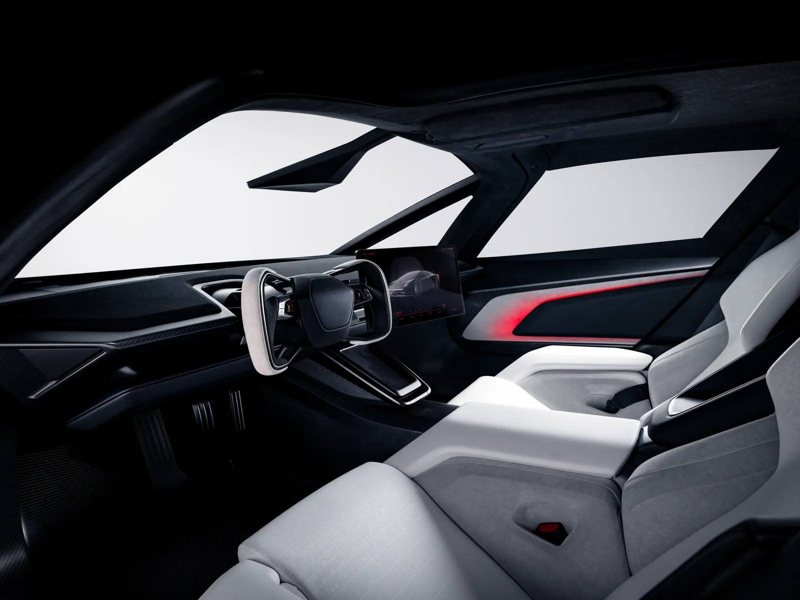 The two-seat cabin: Ultrawhite seats, a yoke, a slim screen and a red ambient line.