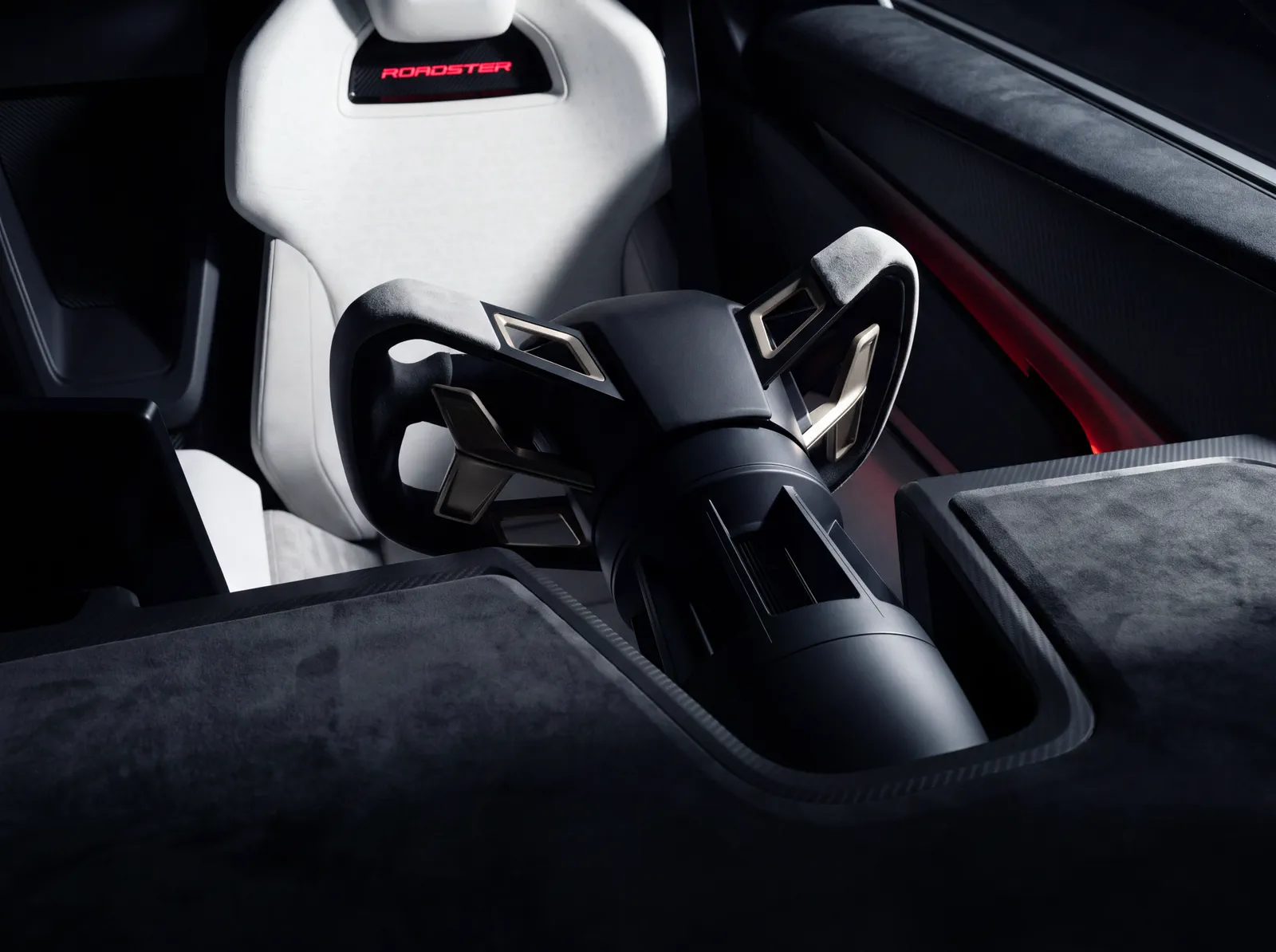 An Ultrawhite seat with the Roadster name glowing red in the headrest.